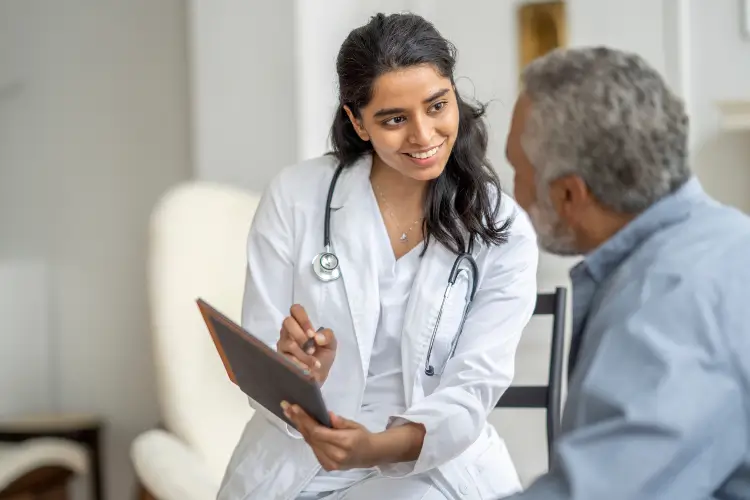 Image of a doctor showing something to the patient